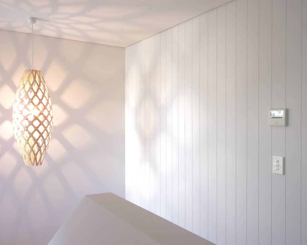 Hardie Groove lining vertical joint wall panels in a bright interior room